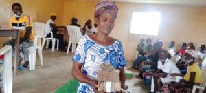 A beneficiary with her cash
